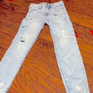 I am selling light blue ripped jeans from American Eagle size 4 regular